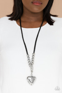Featuring chunky silver beads, an oversized silver heart pendant swings from dramatic silver hook-like fittings that attach to a bold leather cord draped across the chest for a haute heartbreaker look. Features an adjustable clasp closure.
Sold as one individual necklace. Includes one pair of matching earrings. Featuring chunky silver beads, an oversized silver heart pendant swings from dramatic silver hook-like fittings that attach to a bold leather cord draped across the chest for a haute heartbreaker look. Features an adjustable clasp closure.
Sold as one individual necklace. Includes one pair of matching earrings.