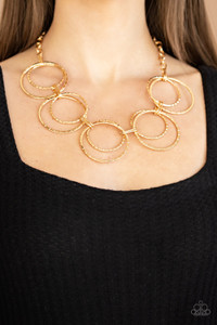 Etched in linear textures, pairs of oversized gold hoops link below the collar for a dramatic industrial display. Features an adjustable clasp closure.
Sold as one individual necklace. Includes one pair of matching earrings. Etched in linear textures, pairs of oversized gold hoops link below the collar for a dramatic industrial display. Features an adjustable clasp closure.
Sold as one individual necklace. Includes one pair of matching earrings.