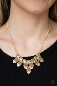 Hammered in shimmer, a collection of asymmetrical gold frames connect into an abstract plate below the collar. Features an adjustable clasp closure.
Sold as one individual necklace. Includes one pair of matching earrings. Hammered in shimmer, a collection of asymmetrical gold frames connect into an abstract plate below the collar. Features an adjustable clasp closure.
Sold as one individual necklace. Includes one pair of matching earrings.