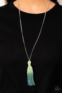 A knotted tassel gradually fades from green to blue at the bottom of a lengthened silver chain, creating a colorful pendant. Features an adjustable clasp closure.
Sold as one individual necklace. Includes one pair of matching earrings. A knotted tassel gradually fades from green to blue at the bottom of a lengthened silver chain, creating a colorful pendant. Features an adjustable clasp closure.
Sold as one individual necklace. Includes one pair of matching earrings.