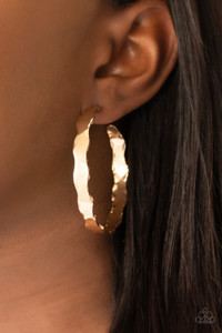 Featuring raw, scalloped edges, a hammered gold hoop curls around the ear for an electrifying look. Earring attaches to a standard post fitting. Hoop measures approximately 2 1/4" in diameter.
Sold as one pair of hoop earrings. Featuring raw, scalloped edges, a hammered gold hoop curls around the ear for an electrifying look. Earring attaches to a standard post fitting. Hoop measures approximately 2 1/4" in diameter.
Sold as one pair of hoop earrings.