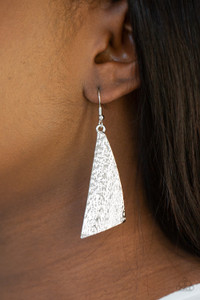 Delicately hammered in blinding shimmer, an asymmetrical silver frame delicately curls into an edgy statement piece. Earring attaches to a standard fishhook fitting.
Sold as one pair of earrings. Delicately hammered in blinding shimmer, an asymmetrical silver frame delicately curls into an edgy statement piece. Earring attaches to a standard fishhook fitting.
Sold as one pair of earrings.