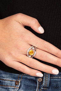 A white rhinestone encrusted band and glistening silver band wave around a radiating yellow and white rhinestone center for a refined look. Features a dainty stretchy band for a flexible fit.
Sold as one individual ring. A white rhinestone encrusted band and glistening silver band wave around a radiating yellow and white rhinestone center for a refined look. Features a dainty stretchy band for a flexible fit.
Sold as one individual ring.