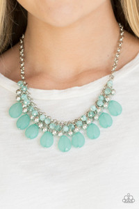 A row of cloudy green beads gives way to a row of shiny silver beads. Brushed in an opalescent finish, green teardrops cascade from the bottom of bold interlocking silver chains, creating a dramatically colorful fringe. Features an adjustable clasp closure.
Sold as one individual necklace. Includes one pair of matching earrings. A row of cloudy green beads gives way to a row of shiny silver beads. Brushed in an opalescent finish, green teardrops cascade from the bottom of bold interlocking silver chains, creating a dramatically colorful fringe. Features an adjustable clasp closure.
Sold as one individual necklace. Includes one pair of matching earrings.