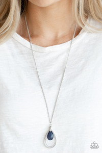 Studded silver teardrops swing from the bottom of a shimmery silver chain. A glowing blue moonstone attaches to the innermost frame, creating a whimsical pendant. Features an adjustable clasp closure.
Sold as one individual necklace. Includes one pair of matching earrings. Studded silver teardrops swing from the bottom of a shimmery silver chain. A glowing blue moonstone attaches to the innermost frame, creating a whimsical pendant. Features an adjustable clasp closure.
Sold as one individual necklace. Includes one pair of matching earrings.