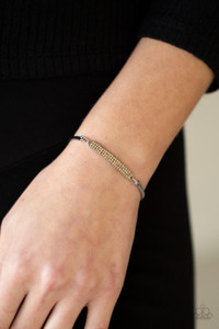 Two arcing silver bands link with a silver frame encrusted in row after row of golden topaz rhinestones, creating a sparkly centerpiece around the wrist. Features an adjustable clasp closure.
Sold as one individual bracelet. Two arcing silver bands link with a silver frame encrusted in row after row of golden topaz rhinestones, creating a sparkly centerpiece around the wrist. Features an adjustable clasp closure.
Sold as one individual bracelet.