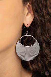 Etched in linear texture, a crescent shaped plate fans out from the bottom of a textured gunmetal oval, coalescing into a blinging metallic display. Earring attaches to a standard fishhook fitting.
Sold as one pair of earrings. Etched in linear texture, a crescent shaped plate fans out from the bottom of a textured gunmetal oval, coalescing into a blinging metallic display. Earring attaches to a standard fishhook fitting.
Sold as one pair of earrings.