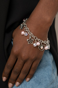 Infused with pink pearls and iridescent crystal-like beads, mismatched silver charms including a clover, butterfly, heart, and floral frames swing from a chunky silver chain around the wrist. Features an adjustable clasp closure.
Sold as one individual bracelet. Infused with pink pearls and iridescent crystal-like beads, mismatched silver charms including a clover, butterfly, heart, and floral frames swing from a chunky silver chain around the wrist. Features an adjustable clasp closure.
Sold as one individual bracelet.
