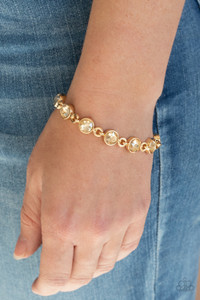 Golden rhinestone encrusted gold frames delicately link around the wrist, creating a timeless centerpiece. Features an adjustable clasp closure.
Sold as one individual bracelet. Golden rhinestone encrusted gold frames delicately link around the wrist, creating a timeless centerpiece. Features an adjustable clasp closure.
Sold as one individual bracelet.