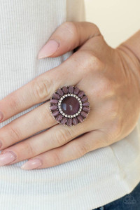 Purple cat's eye stone petals elegantly bloom from a dreamy purple cat's eye center that has been encrusted in a ring of glassy white rhinestones for an elegant finish. Features a stretchy band for a flexible fit.
Sold as one individual ring. Purple cat's eye stone petals elegantly bloom from a dreamy purple cat's eye center that has been encrusted in a ring of glassy white rhinestones for an elegant finish. Features a stretchy band for a flexible fit.
Sold as one individual ring.