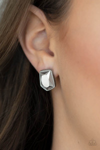 Featuring a raw asymmetrical cut, a smoky hematite gem is encased inside a sleek silver frame, creating an edgy display. Earring attaches to a standard post fitting.
Sold as one pair of post earrings. Featuring a raw asymmetrical cut, a smoky hematite gem is encased inside a sleek silver frame, creating an edgy display. Earring attaches to a standard post fitting.
Sold as one pair of post earrings.