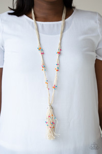 Dainty orange, blue, and pink wooden beads are sporadically threaded along earthy strands of knotted twine-like layers draped across the chest. Matching beaded strands stream out from the bottom of a decorative silver cap, creating a whimsical tassel. Features an adjustable clasp closure.
Sold as one individual necklace. Includes one pair of matching earrings. Dainty orange, blue, and pink wooden beads are sporadically threaded along earthy strands of knotted twine-like layers draped across the chest. Matching beaded strands stream out from the bottom of a decorative silver cap, creating a whimsical tassel. Features an adjustable clasp closure.
Sold as one individual necklace. Includes one pair of matching earrings.