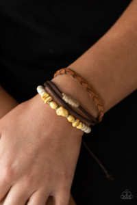 Mismatched strands of brown suede, braided brown leather, and yellow stones and white wooden beads layer across the wrist for a colorful seasonal look. Features an adjustable sliding knot closure.

Sold as one individual bracelet.
