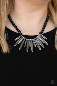 Acrylic icicles drip from the center of a strand of black beads, creating an intensely icy fringe below the collar. Features an adjustable clasp closure.

Sold as one individual necklace. Includes one pair of matching earrings.