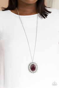 Bordered in bubbly white rhinestone encrusted petals, the center of a studded silver floral frame is dotted with an oversized purple cat's eye stone, creating a whimsical medallion at the bottom of a lengthened silver chain. Features an adjustable clasp closure.
Sold as one individual necklace. Includes one pair of matching earrings. Bordered in bubbly white rhinestone encrusted petals, the center of a studded silver floral frame is dotted with an oversized purple cat's eye stone, creating a whimsical medallion at the bottom of a lengthened silver chain. Features an adjustable clasp closure.
Sold as one individual necklace. Includes one pair of matching earrings.