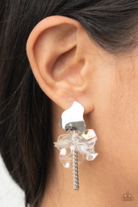 Dainty silver chains stream out from the bottom of iridescent acrylic petal-like frames that attach to an asymmetrical silver frame, creating an enchanting cluster. Earring attaches to a standard post fitting.
Sold as one pair of post earrings. Dainty silver chains stream out from the bottom of iridescent acrylic petal-like frames that attach to an asymmetrical silver frame, creating an enchanting cluster. Earring attaches to a standard post fitting.
Sold as one pair of post earrings.