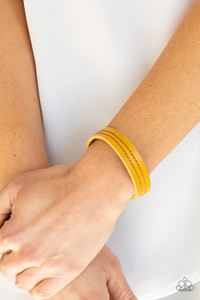 The front of a dainty yellow leather band is stitched in two linear rows, creating a colorfully rustic centerpiece around the wrist. Features an adjustable snap closure.
Sold as one individual bracelet. The front of a dainty yellow leather band is stitched in two linear rows, creating a colorfully rustic centerpiece around the wrist. Features an adjustable snap closure.
Sold as one individual bracelet.