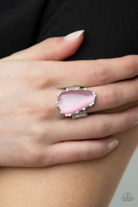 A tranquil asymmetrical pink cat's eye stone is encased in a delicately dotted shimmery silver frame. Dainty sparkly white rhinestones surround the oversized stone creating an elegant centerpiece atop the finger. Features a stretchy band for a flexible fit.
Sold as one individual ring. A tranquil asymmetrical pink cat's eye stone is encased in a delicately dotted shimmery silver frame. Dainty sparkly white rhinestones surround the oversized stone creating an elegant centerpiece atop the finger. Features a stretchy band for a flexible fit.
Sold as one individual ring.