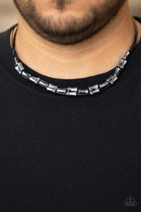 Shiny black cording weaves through a collection of glistening silver beads below the collar for an edgy, urban look. Features a button loop closure.
Sold as one individual necklace Shiny black cording weaves through a collection of glistening silver beads below the collar for an edgy, urban look. Features a button loop closure.
Sold as one individual necklace