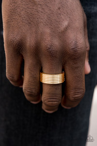 A thick gold band is lined in stacked linear textures for a sleek metro look. Features a stretchy band for a flexible fit.
Sold as one individual ring. A thick gold band is lined in stacked linear textures for a sleek metro look. Features a stretchy band for a flexible fit.
Sold as one individual ring.