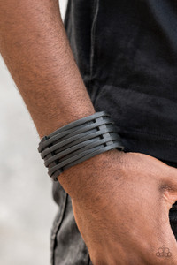 A thick black leather band has been spliced into skinny strands that interweave through leather belt loops across the wrist for a rugged look. Features an adjustable snap closure.
Sold as one individual bracelet. A thick black leather band has been spliced into skinny strands that interweave through leather belt loops across the wrist for a rugged look. Features an adjustable snap closure.
Sold as one individual bracelet.