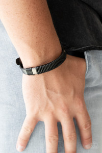 Infused with metallic accents, shiny black cording wraps around a black leather band for an urban look. Features an adjustable snap closure.
Sold as one individual bracelet. Infused with metallic accents, shiny black cording wraps around a black leather band for an urban look. Features an adjustable snap closure.
Sold as one individual bracelet.