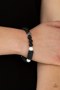 Infused white shiny white beads, earthy black rocks are threaded along a stretchy band around the wrist. Block-like metallic and lava beads are added to the seasonal compilation for an edgy finish.

Sold as one individual bracelet.