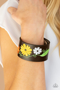 A colorful floral pattern is embroidered across the front of a brown leather band, creating a whimsical centerpiece around the wrist. Features an adjustable snap closure.
Sold as one individual bracelet. A colorful floral pattern is embroidered across the front of a brown leather band, creating a whimsical centerpiece around the wrist. Features an adjustable snap closure.
Sold as one individual bracelet.