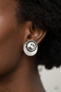 Dotted with an oversized white gem, the flared bottom of a studded silver frame is encrusted in row after row of glassy white rhinestones for a refined flair. Earring attaches to a standard clip-on fitting.
Sold as one pair of clip-on earrings. Dotted with an oversized white gem, the flared bottom of a studded silver frame is encrusted in row after row of glassy white rhinestones for a refined flair. Earring attaches to a standard clip-on fitting.
Sold as one pair of clip-on earrings.