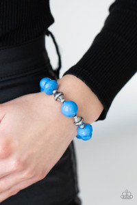 A collection of polished French Blue beads in smooth round and faceted shapes, are threaded along a stretchy band. Accents of silver beads etched in linear designs adds a down to earth finish to the whimsical bracelet.
Sold as one individual bracelet. A collection of polished French Blue beads in smooth round and faceted shapes, are threaded along a stretchy band. Accents of silver beads etched in linear designs adds a down to earth finish to the whimsical bracelet.
Sold as one individual bracelet.