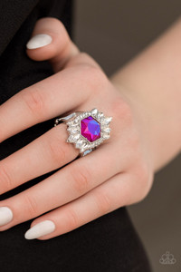 Featuring a radiant UV shimmer, a hexagonal pink rhinestone is pressed into the center of round and marquise cut white rhinestones that dramatically coalesce into an out-of-this-world centerpiece atop the finger. Features a stretchy band for a flexible fit.

Sold as one individual ring.