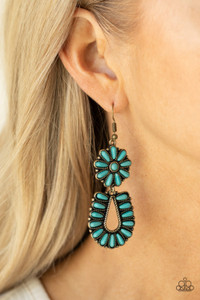 Infused with studded brass fittings, two turquoise stone frames connect into a squash blossom for an authentically southwestern inspired look. Earring attaches to a standard fishhook fitting.
Sold as one pair of earrings. Infused with studded brass fittings, two turquoise stone frames connect into a squash blossom for an authentically southwestern inspired look. Earring attaches to a standard fishhook fitting.
Sold as one pair of earrings.