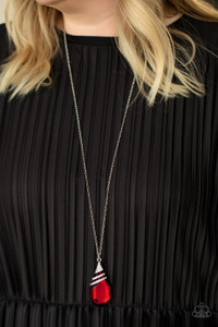 Capped in a white rhinestone encrusted fitting, glittery silver ribbons of white rhinestones delicately wrap around the top of a dramatically oversized red teardrop gem. The fiery red pendant swings from the bottom of a lengthened silver chain, creating a glamorous statement piece. Features an adjustable clasp closure.
Sold as one individual necklace. Includes one pair of matching earrings. Capped in a white rhinestone encrusted fitting, glittery silver ribbons of white rhinestones delicately wrap around the top of a dramatically oversized red teardrop gem. The fiery red pendant swings from the bottom of a lengthened silver chain, creating a glamorous statement piece. Features an adjustable clasp closure.
Sold as one individual necklace. Includes one pair of matching earrings.