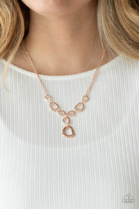 Irregular shaped rose gold rings connect to a rose gold chain as they make their way across the collar. Two rings dangle from the center for a stylish avant-garde fashion. Features an adjustable clasp closure.
Sold as one individual necklace. Includes one pair of matching earrings. Irregular shaped rose gold rings connect to a rose gold chain as they make their way across the collar. Two rings dangle from the center for a stylish avant-garde fashion. Features an adjustable clasp closure.
Sold as one individual necklace. Includes one pair of matching earrings.