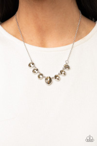Encased in sleek silver fittings, elegant cut golden topaz rhinestones delicately connect below the collar. An oversized golden topaz rhinestone adorns to the middle of the glittery strand, creating a sparkly centerpiece. Features an adjustable clasp closure.
Sold as one individual necklace. Includes one pair of matching earrings. Encased in sleek silver fittings, elegant cut golden topaz rhinestones delicately connect below the collar. An oversized golden topaz rhinestone adorns to the middle of the glittery strand, creating a sparkly centerpiece. Features an adjustable clasp closure.
Sold as one individual necklace. Includes one pair of matching earrings.