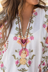Three shimmery gold discs featuring a wavy pattern flowing across the front, link together in graduating sizes at the end of a lengthened brown cord for an alluring appeal. Features an adjustable clasp closure.
Sold as one individual necklace. Includes one pair of matching earrings. Three shimmery gold discs featuring a wavy pattern flowing across the front, link together in graduating sizes at the end of a lengthened brown cord for an alluring appeal. Features an adjustable clasp closure.
Sold as one individual necklace. Includes one pair of matching earrings.