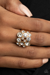 Encased in sleek gold frames, a bubbly collection of sparkly white rhinestones coalesces into a glamorous band across the finger. Features a stretchy band for a flexible fit.
Sold as one individual ring. Encased in sleek gold frames, a bubbly collection of sparkly white rhinestones coalesces into a glamorous band across the finger. Features a stretchy band for a flexible fit.
Sold as one individual ring.