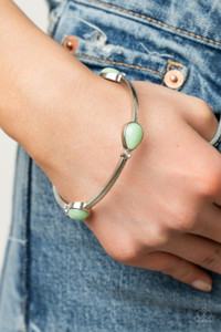 Pairs of glassy Green Ash teardrops and dainty white rhinestones embellish a classic silver bangle, creating a dreamy display around the wrist.

Sold as one individual bracelet.