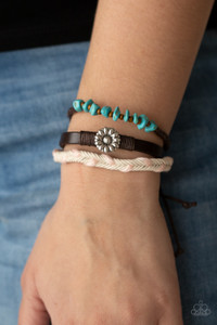 Featuring a silver floral centerpiece, mismatched strands of turquoise stones and wooden beads, brown leather, and braided pink and white cording layers across the wrist for a seasonal flair. Features an adjustable sliding knot closure.
Sold as one individual bracelet. Featuring a silver floral centerpiece, mismatched strands of turquoise stones and wooden beads, brown leather, and braided pink and white cording layers across the wrist for a seasonal flair. Features an adjustable sliding knot closure.
Sold as one individual bracelet.