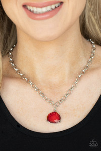 An oversized glassy red gem is pressed into a pronged silver fitting at the bottom of a chunky silver chain, creating a dramatic pendant below the collar. Features an adjustable clasp closure.
Sold as one individual necklace. Includes one pair of matching earrings. An oversized glassy red gem is pressed into a pronged silver fitting at the bottom of a chunky silver chain, creating a dramatic pendant below the collar. Features an adjustable clasp closure.
Sold as one individual necklace. Includes one pair of matching earrings.