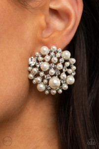 A bubbly collection of timeless pearls and glassy white rhinestones coalesce into an oversized circular frame, creating a sparkly statement. Earring attaches to a standard clip-on fitting.

Sold as one pair of clip-on earrings.