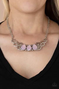 Featuring an opaque iridescence, a row of pink teardrop beads are pressed into a studded backdrop of vine-like silver filigree, creating a whimsical centerpiece below the collar. Features an adjustable clasp closure.
Sold as one individual necklace. Includes one pair of matching earrings. Featuring an opaque iridescence, a row of pink teardrop beads are pressed into a studded backdrop of vine-like silver filigree, creating a whimsical centerpiece below the collar. Features an adjustable clasp closure.
Sold as one individual necklace. Includes one pair of matching earrings.