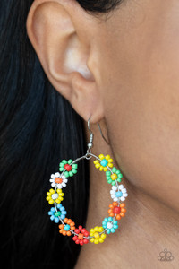 Dotted with mismatched multicolored beaded centers, a dainty collection of multicolored seed beaded floral frames are threaded along a wire hoop for a fabulous floral fashion. Earring attaches to a standard fishhook fitting.
Sold as one pair of earrings. Dotted with mismatched multicolored beaded centers, a dainty collection of multicolored seed beaded floral frames are threaded along a wire hoop for a fabulous floral fashion. Earring attaches to a standard fishhook fitting.
Sold as one pair of earrings.