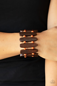 Pairs of Burnt Orange wooden beads and oblong brown wooden frames alternate along stretchy bands around the wrist for a seasonal pop of color.
Sold as one individual bracelet. Pairs of Burnt Orange wooden beads and oblong brown wooden frames alternate along stretchy bands around the wrist for a seasonal pop of color.
Sold as one individual bracelet.