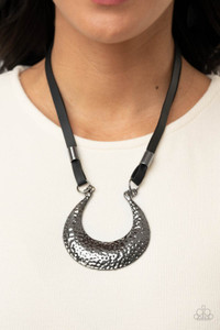 Infused with glistening gunmetal beads, strips of black leather link to an oversized half moon pendant that is hammered in a blinding gunmetal finish, creating an edgy statement piece below the collar. Features an adjustable clasp closure.
Sold as one individual necklace. Includes one pair of matching earrings. Infused with glistening gunmetal beads, strips of black leather link to an oversized half moon pendant that is hammered in a blinding gunmetal finish, creating an edgy statement piece below the collar. Features an adjustable clasp closure.
Sold as one individual necklace. Includes one pair of matching earrings.