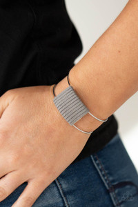 Ultimate Gray suede cording wraps around a silver fitting nestled between an airy silver cuff, creating a colorfully rustic centerpiece.
Sold as one individual bracelet. Ultimate Gray suede cording wraps around a silver fitting nestled between an airy silver cuff, creating a colorfully rustic centerpiece.
Sold as one individual bracelet.