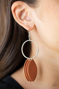 Leafy Adobe leather frames swing from the bottom of a textured silver hoop, creating an earthy fringe. Earring attaches to a standard fishhook fitting.
Sold as one pair of earrings. Leafy Adobe leather frames swing from the bottom of a textured silver hoop, creating an earthy fringe. Earring attaches to a standard fishhook fitting.
Sold as one pair of earrings.