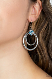 Smooth and textured silver hoops connect to the bottom of a silver fitting embellished in glitzy blue and hematite rhinestones, creating a dizzying lure. Earring attaches to a standard fishhook fitting.
Sold as one pair of earrings. Smooth and textured silver hoops connect to the bottom of a silver fitting embellished in glitzy blue and hematite rhinestones, creating a dizzying lure. Earring attaches to a standard fishhook fitting.
Sold as one pair of earrings.
