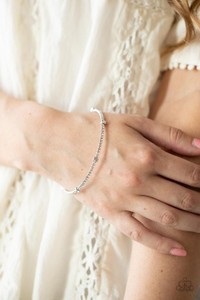Encased in shiny silver fittings, a sparkly collection of solitaire white rhinestones adorn a glittery strand of dainty white rhinestones that coil around the wrist, creating a dainty cuff.
Sold as one individual bracelet. Encased in shiny silver fittings, a sparkly collection of solitaire white rhinestones adorn a glittery strand of dainty white rhinestones that coil around the wrist, creating a dainty cuff.
Sold as one individual bracelet.