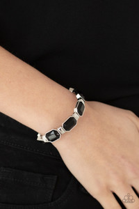 Encased in sleek silver fittings, faceted black beads join dainty silver rectangular frames along stretchy bands around the wrist for a dainty pop of color.
Sold as one individual bracelet. Encased in sleek silver fittings, faceted black beads join dainty silver rectangular frames along stretchy bands around the wrist for a dainty pop of color.
Sold as one individual bracelet.